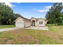 Beautiful one-story home with a large yard and a two-car garage at 17279 Peggy Ave, Mount Dora, FL 32757