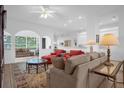 Spacious living room with comfortable seating and a view to kitchen at 21242 Braveheart Dr, Leesburg, FL 34748
