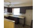 Simple kitchen with dark cabinets and vinyl flooring at 525 Conway Rd # 201, Orlando, FL 32807