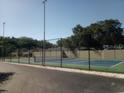 Community tennis court with chain link fence at 525 Conway Rd # 201, Orlando, FL 32807