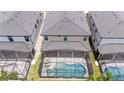 Aerial view of houses with pools and screened enclosures at 5887 High Seas Dr, Orlando, FL 32821