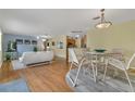 Bright dining area with wood floors and seating for four at 1285 Chesnee Pl, The Villages, FL 32162