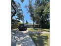 House exterior with large trees and a driveway at 608 N Summerlin Ave, Orlando, FL 32803