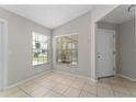 Bright and airy entryway with tile floors and neutral walls at 4704 Cheyenne Point Trl, Kissimmee, FL 34746