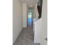 Bright and airy entryway with tile floors and staircase at 265 Reena Dr, Daytona Beach, FL 32117