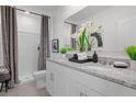 Double vanity bathroom with shower and modern finishes at 271 Reena Dr, Daytona Beach, FL 32117