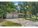 Charming single-story home with a two-car garage and well-manicured lawn at 233 S 4Th St, Lake Mary, FL 32746