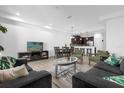 Open concept living and dining area with kitchen views at 8110 Roseville Rd, Davenport, FL 33896