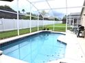Inviting screened pool with a spacious deck area at 320 Henley Cir, Davenport, FL 33896