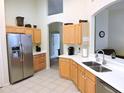 Modern kitchen with stainless steel appliances and ample counter space at 320 Henley Cir, Davenport, FL 33896