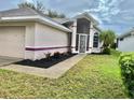 House exterior showcasing the front entrance and landscaping at 5610 King James Ave, Leesburg, FL 34748