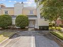 Front entrance of a townhome with landscaping and parking at 7502 Seven Eagles Way, Reunion, FL 34747