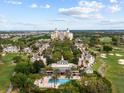 Aerial view of luxury resort community with golf course at 7502 Seven Eagles Way, Reunion, FL 34747