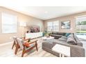 Spacious living room with sectional sofa and large TV at 1548 Moon Valley Dr, Davenport, FL 33896