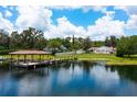 Aerial view of waterfront home with dock and gazebo at 325 Magnolia St, Windermere, FL 34786