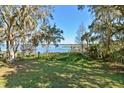 Spacious backyard with lake view and private dock at 10611 Jim Edwards Rd, Haines City, FL 33844