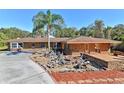 Ranch style home with stone exterior and landscaping at 10611 Jim Edwards Rd, Haines City, FL 33844