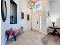 Bright and spacious entryway with tile flooring at 13333 Early Frost Cir, Orlando, FL 32828