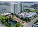 Aerial view of waterfront high rise building and parking at 231 Riverside Drive # 1209-1, Holly Hill, FL 32117