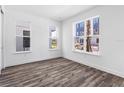 Spacious bedroom with hardwood floors and large windows at 2122 Whitney Marsh Aly, Orlando, FL 32804