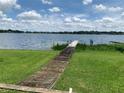 Wooden dock extending over calm lake water at 207 Robin Rd, Altamonte Springs, FL 32701