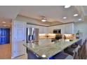 Modern kitchen featuring stainless steel appliances and granite countertops at 5300 S Atlantic Ave # 16-602, New Smyrna Beach, FL 32169