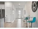 Bright and spacious entryway with tile flooring at 9106 Sommerset Hills Dr, Davenport, FL 33896