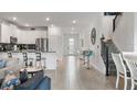 Open concept kitchen with island and stainless steel appliances at 9106 Sommerset Hills Dr, Davenport, FL 33896