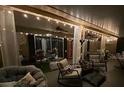 Cozy patio with string lights and comfortable seating at 1046 Shinnecock Hills Dr, Oviedo, FL 32765