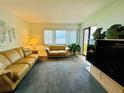 Living room with ocean view and comfy furniture at 4175 S Atlantic Ave # 1020, New Smyrna Beach, FL 32169