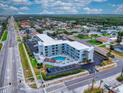 Aerial view of building, pool, parking and surrounding area at 3700 S Atlantic Ave # 407, New Smyrna Beach, FL 32169