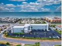 Aerial view showing condo building and ocean at 3700 S Atlantic Ave # 407, New Smyrna Beach, FL 32169