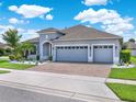 Beautiful two-story home with three-car garage and landscaped yard at 12111 Beach Fern Rd., Orlando, FL 32824