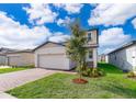 Two-story house with a modern facade and landscaped yard at 2370 Brassie Ct, Winter Haven, FL 33884