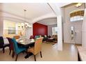 Open dining room with chandelier and seating for six at 401 Cabello Dr, Davenport, FL 33837