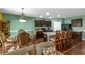 Spacious kitchen with dark cabinets and hardwood floors at 205 Hamlet Rd, Davenport, FL 33837