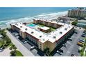 Aerial view of beachfront property, showing oceanfront location and parking at 3801 S Atlantic Ave # Ut305, New Smyrna Beach, FL 32169