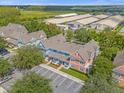 Aerial view of townhouses with parking at 2213 San Vittorino Cir # 106, Kissimmee, FL 34741