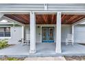 Inviting front porch with rocking chairs and double doors at 8342 Starr Dr, Orlando, FL 32818