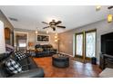 Comfortable living room with leather sofas and a large TV at 8342 Starr Dr, Orlando, FL 32818