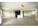 Open floor plan with kitchen, living, and dining areas at 8502 Arcadia Ln, Davenport, FL 33896