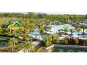 Resort-style pool with water slides, lazy river, and ample lounge space at 14501 Grove Resort Ave # 3229, Winter Garden, FL 34787