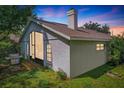 Rear view of house, showcasing a screened patio and grill area at 2431 Pewter Ct, Orlando, FL 32837