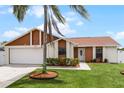 Updated 2 bed, 2 bath home with a landscaped lawn and attached garage at 137 Birmingham Dr, Kissimmee, FL 34758