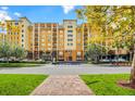 Luxury condo building with convenient street access and landscaping at 8112 Poinciana Blvd # 1305, Orlando, FL 32821