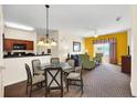 Bright and airy living room with comfortable seating and access to balcony at 8112 Poinciana Blvd # 1305, Orlando, FL 32821