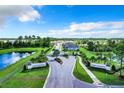 Entrance to Cagan Crossings community with ponds and landscaping at 17184 Cagan Crossings Blvd, Clermont, FL 34714