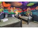 bedroom with Toy Story mural and two twin beds at 9101 El Caro Ln, Davenport, FL 33896