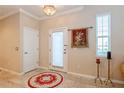 Elegant entryway with tile flooring and a decorative rug at 5388 Via Appia Way, Sanford, FL 32771