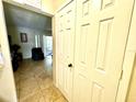Hallway with tiled floor leading to living room at 3970 Versailles Dr # 3970B, Orlando, FL 32808